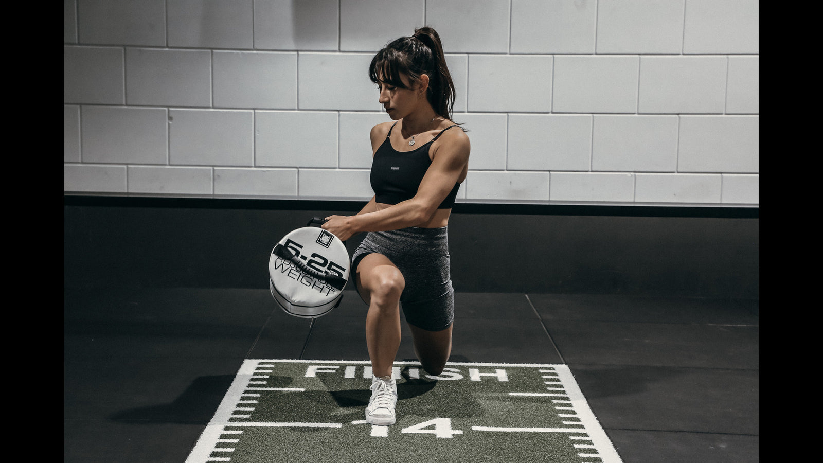 Unleash Your Strength with the Dynamic Sandbag Throw Exercise with